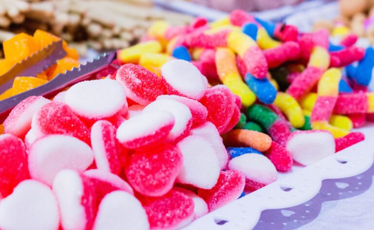 Close-up of a vibrant assortment of gummy candies displayed on a table.