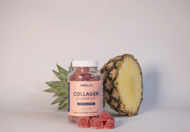 Collagen gummies bottle with a pineapple in a still life setup, promoting health and nutrition.
